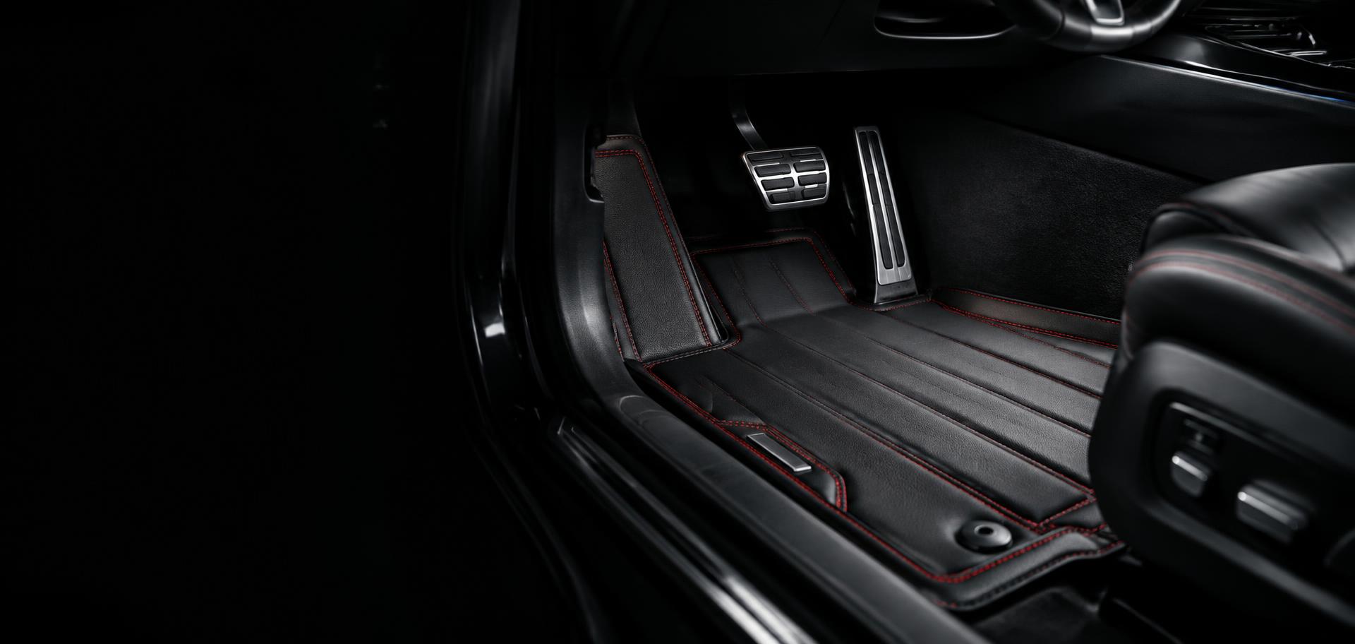 X1Mats custom-fitted leather floor mats in a luxury car interior